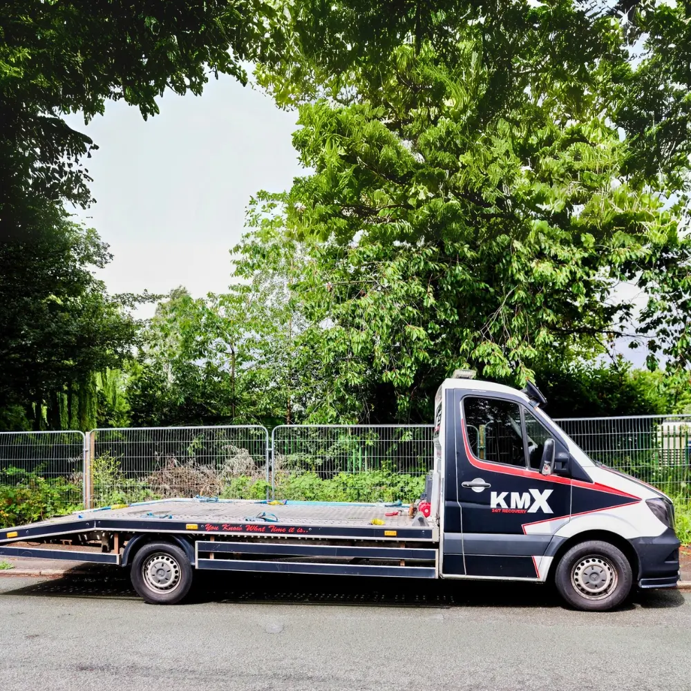"A KMX Recovery vehicle shown with a side shot, waiting to begin its job."